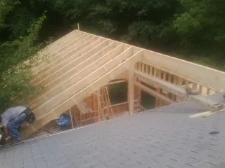 Framing a new roof addition that ties into an existing shingle roof in Geneva